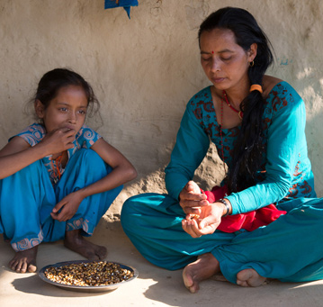 Kalpana Oli with her daughter Binita. Credit: Aubrey Wade